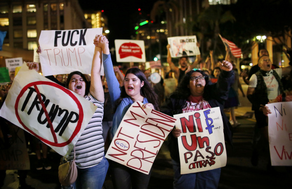 Demonstrators walk through Downtown San Diego in protest to the election of Republican Donald Trump as the president of the United States in San Diego, California, U.S. November 9, 2016. REUTERS/Sandy Huffaker TEMPLATE OUT